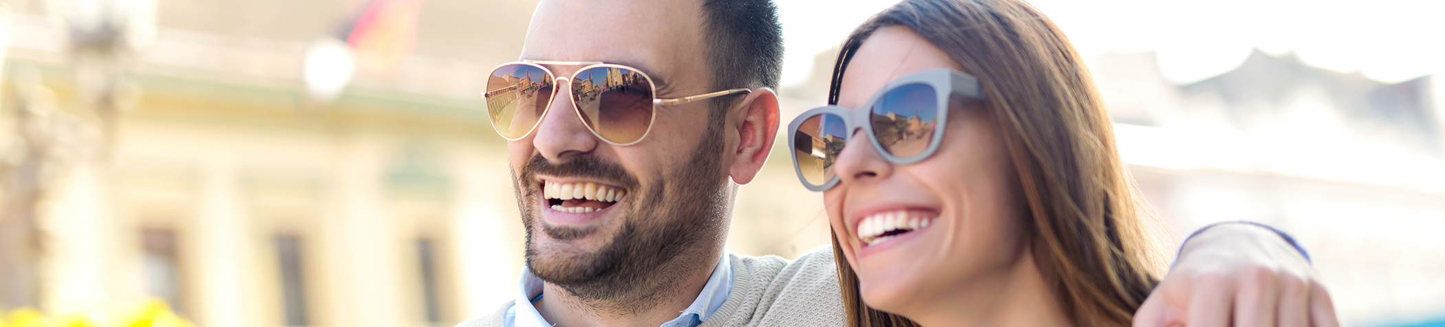Man and woman wearing sunglasses