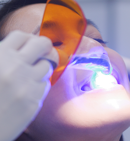 Patient receiving dental bonding treatment