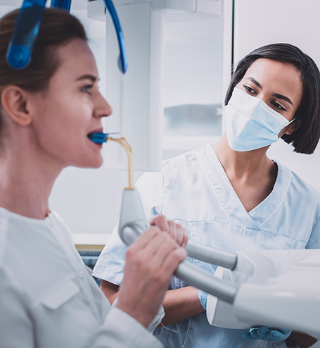 Dental team member scanning patient's mouth