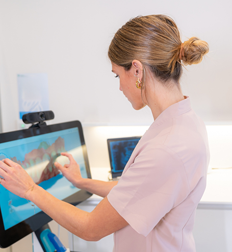 Looking at digital impression of teeth on monitor
