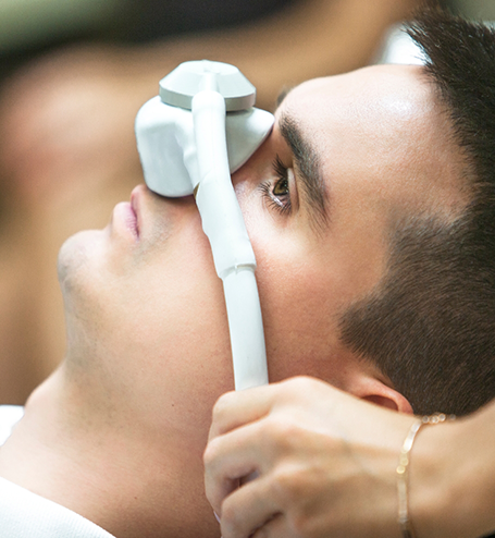Male patient having nasal mask placed over nose