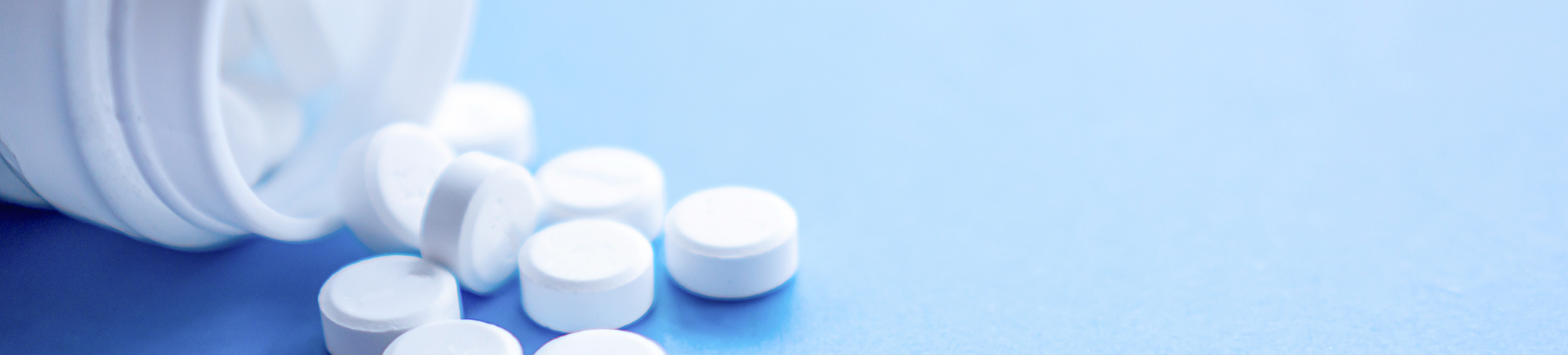 Pouring pills out of a bottle